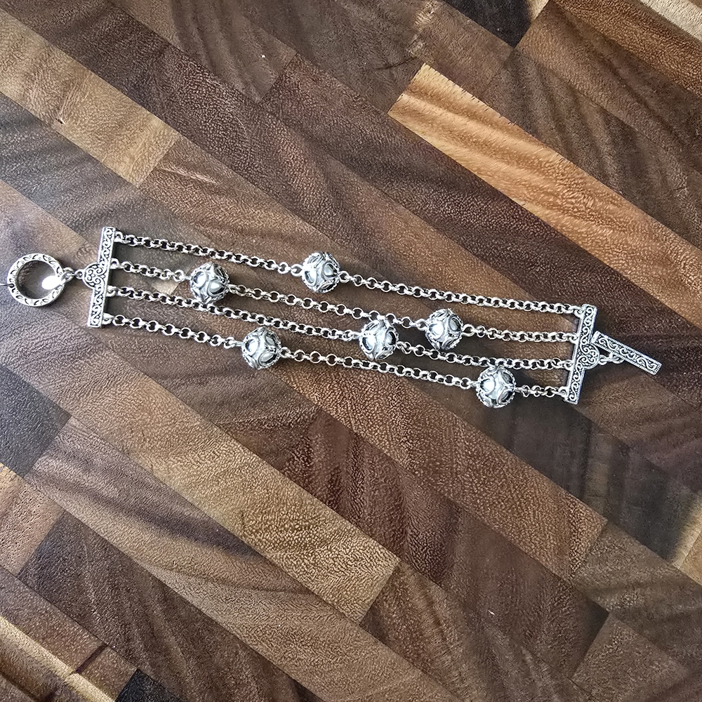 Premier Designs Silver Charm Bracelet with Intricate Detailing